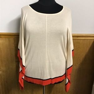 Sweater with flaring arms